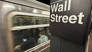 A train arrives at a Wall Street underground station in New York's Financial District