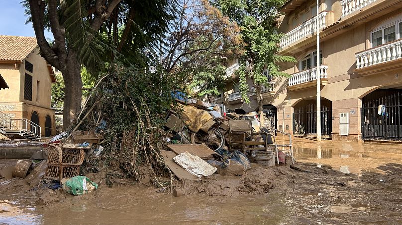 Lost belongings in the muddy floodwaters of Paiporta's streets 