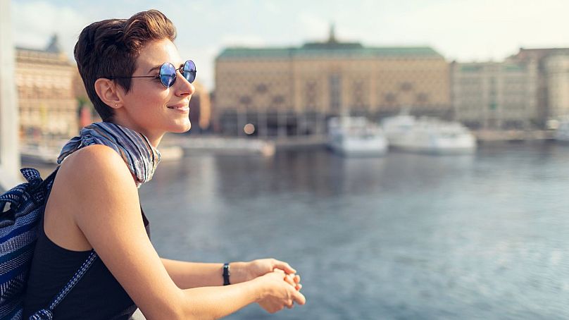 A young woman looks out over Stockholm