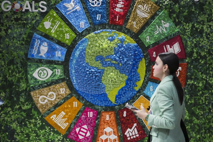 A person walks past art in the Turkey Pavilion at the COP29 UN Climate Summit in Baku, November 2024