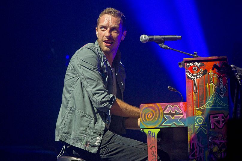 Chris Martin of Coldplay performs on the Pyramid stage at Glastonbury Music Festival