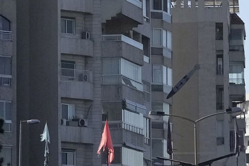 A bomb dropped from an Israeli jet hits a building in Tayouneh, Beirut, Lebanon, Friday, Nov. 15, 2024. 