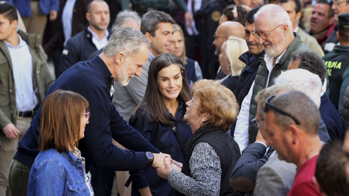 Spain’s royals return to flood-hit region after being pelted with mud