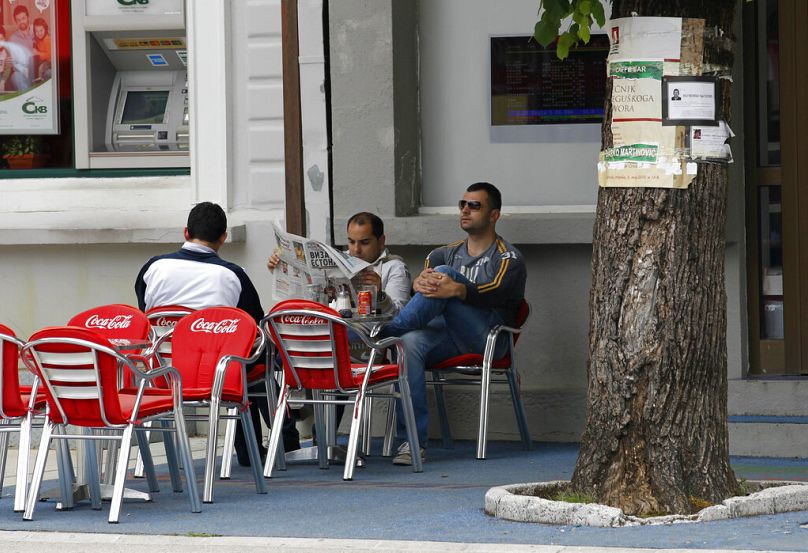 People sit in a cafe in downtown Cetinje, Montenegro, some 30 km south of Podgorica, May 2010