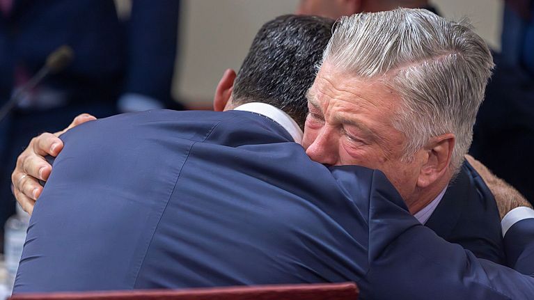 Actor Alec Baldwin hugs defense attorney Alex Spiro as a judge dismisses the involuntary manslaughter case over the 2021 "Rust" set shooting. 
