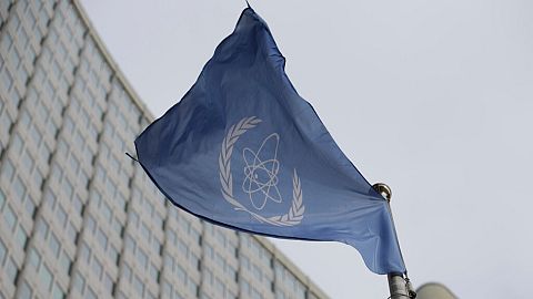 The flag of the International Atomic Energy Agency flies in front of its headquarters during an IAEA Board of Governors meeting in Vienna, Austria, on Feb. 6, 2023. 