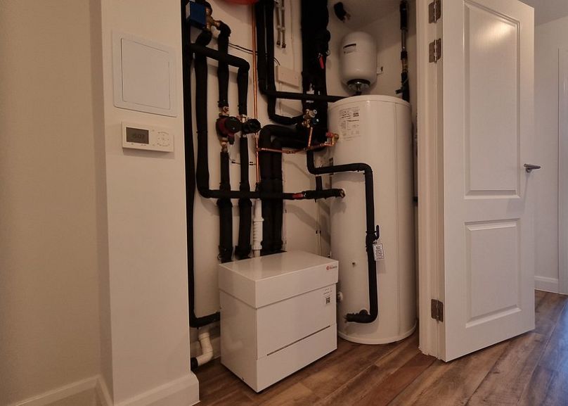 Shoebox heat pumps installed in individual flats are connected to a shared network of underground pipework.