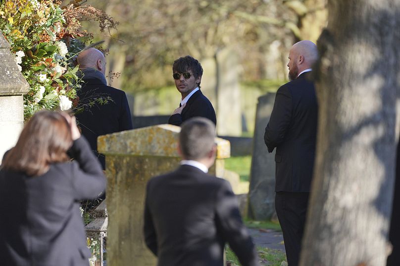 Former One Direction band member Louis Tomlinson arrives for the funeral service of One Direction singer Liam Payne at St Mary's Church. 