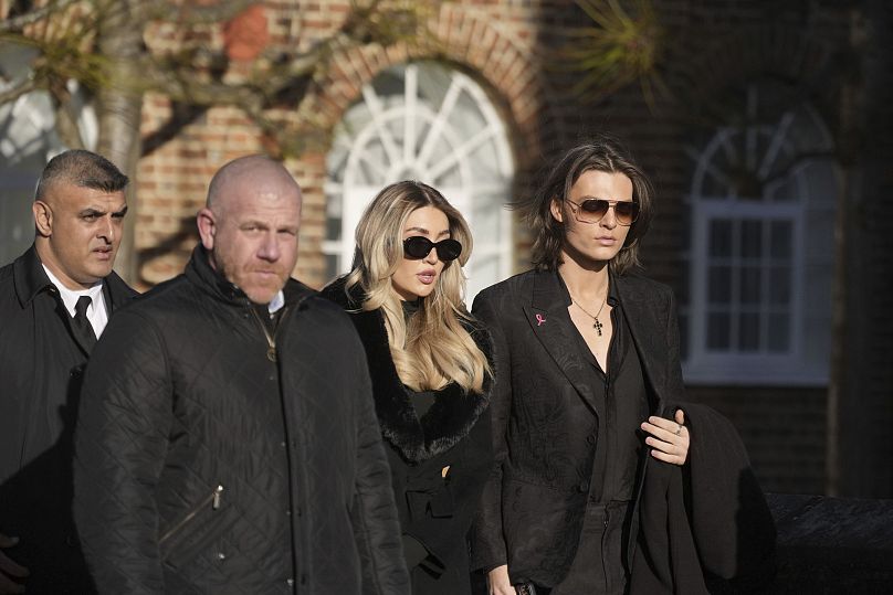 Damian Hurley, right, and Kate Cassidy, second right, arrives the funeral service of One Direction singer Liam Payne at St Mary's Church