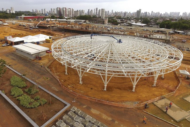 Construction workers walk around Parque da Cidade, or City Park, in Belem, Brazil, Sept. 24, 2024, a project being built for the COP30 UN Climate Summit. 