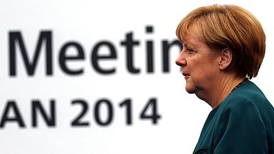 German Chancellor Angela Merkel arrives to Milan's International fair for the second day of a ASEM summit of European and Asian leaders, in Milan, Italy, Friday, Oct. 17, 2014