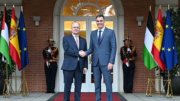 Palestinian Prime Minister Mohammad Mustafa (left) shakes hands with Spanish Prime Minister Pedro Sánchez (right). Palestinian Prime Minister Mohammad Mustafa (left) shakes hands with Spanish Prime Minister Pedro Sánchez (right).