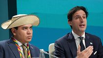 EU climate commissioner Wopke Hoekstra, right, attends a COP29 session, seated beside Panama Climate Envoy Juan Carlos Monterrey Gomez, 21 November.