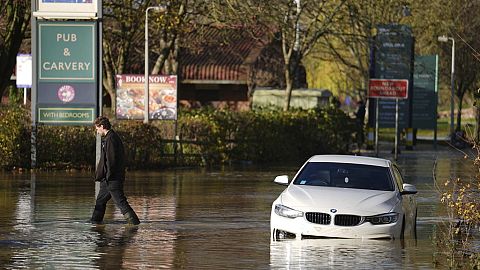A stranded car in flood water at the Billing Aquadrome as Storm Bert continues to cause disruption in Northampton, England, Monday, Nov. 25, 2024. Jordan Pettitt/PA via AP)