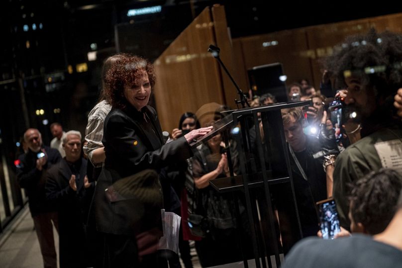 Nan Goldin speaks at the opening of her exhibition "Nan Goldin. This Will Not End Well" at the Neue Nationalgalerie museum in Berlin , Friday, Nov. 22. 2024.