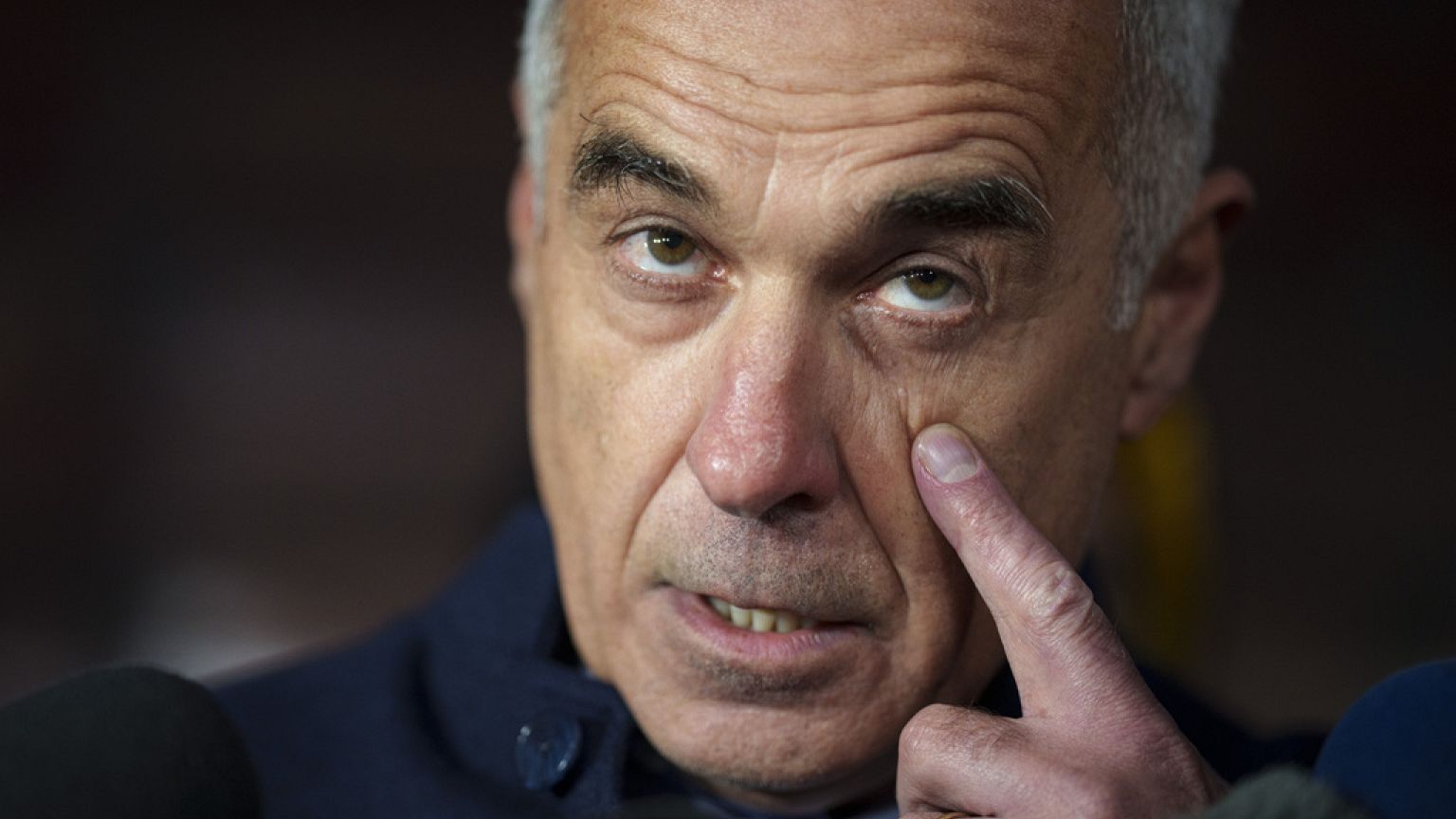 Calin Georgescu, running as an independent candidate for president touches his face while speaking to media, in Izvorani, Romania, Tuesday, Nov. 26, 2024.