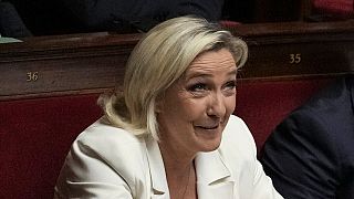 French far-right leader Marine Le Pen reacts during the speech of Prime Minister Michel Barnier at the National Assembly, in Paris, Tuesday, Oct. 1, 2024.