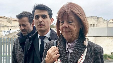 Gisele Pelicot, right, arrives with lawyers Antoine Camus, left, and Stéphane Babonneauat the palace of justice after a break Monday, Nov. 25, 2024.
