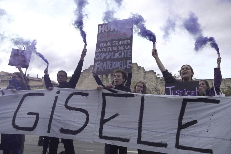 Women demonstrate to mark the International Day for the Elimination of Violence against Women, as the trial of dozens of men accused of raping Gisele Pelicot continues.