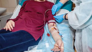 A woman receives dialysis treatment at a medical centre.