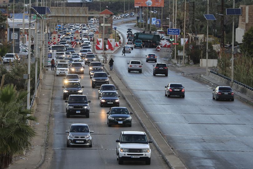 Displaced residents sit in traffic as they return to their villages after a ceasefire between Israel and Hezbollah in Awali, southern Lebanon, Wednesday, Nov. 27, 2024. (AP Ph