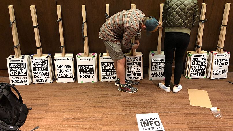 Placards are stacked by Amazon workers in preparation for climate protests