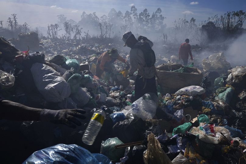 Recyclable collectors work at the Lixao open-air dump in Santo Antonio do Descoberto, Goias state, Brazil.