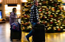 Travellers move through 30th Street Station in Philadelphia, Wednesday, Dec. 21, 2022. 
