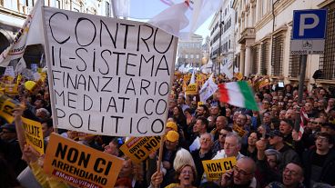 Workers march in Italy to protest against government's budget law and low salaries