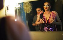 FILE - Performers Penelopa, right, and Veranda, left, who would only give their stage names, get ready backstage at a nightclub in Sochi, Russia Saturday, Feb. 8, 2014,