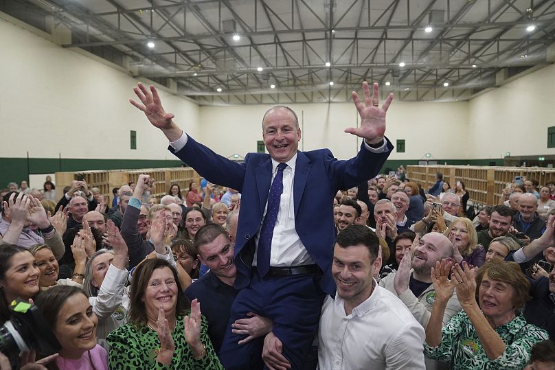 Fianna Fáil leader Micheál Martin held by his sons at the Nemo Rangers GAA Club in Cork, 30 November, 2024