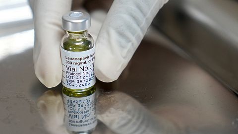 FILE - A pharmacist holds a vial of lenacapavir, the new HIV prevention injectable drug, at the Desmond Tutu Health Foundation's Masiphumelele Research Site, in Cape Town.