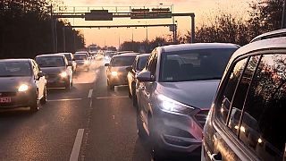 A long line of cars queue on their way to the Hungarian-Austrian border crossing at Sopron. 