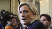 French far-right leader Marine Le Pen answers reporters at the National Assembly in Paris, France, Monday, Dec. 2, 2024