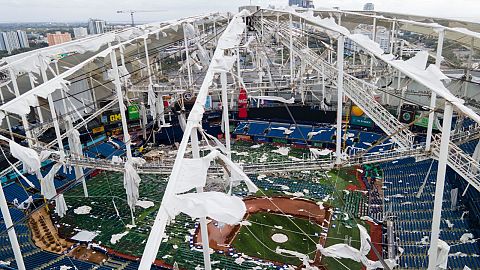 The roof of the Tropicana Field, damaged the morning after Hurricane Milton hit the region, 10 October 2024, in St. Petersburg, Florida. 