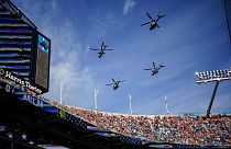 US Marine Light Attack Helicopter Squadron 269 flies over Bank of America Stadium before an NFL football game 
