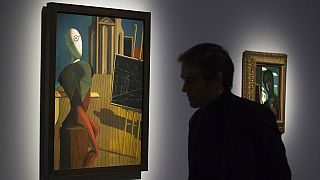 File photo: A man looks at a painting entitled 'Le Prophete, 1914-1915' by Greek-born Italian artist Giorgio de Chirico in the Pompidou Centre, Paris, Oct. 29, 2013 