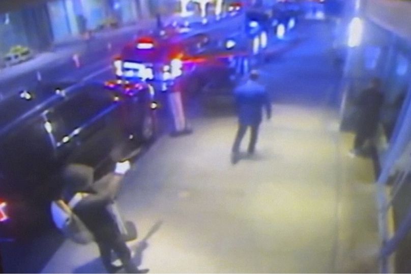 Still image from a surveillance video showing the suspect, left, sought in the the killing of UnitedHealthcare CEO Brian Thompson, centre. Wednesday, Dec. 4, 2024.