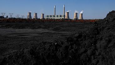 Steam billows from the Duvha Power Station, a coal-fired power plant, in Mpumalanga, South Africa.
