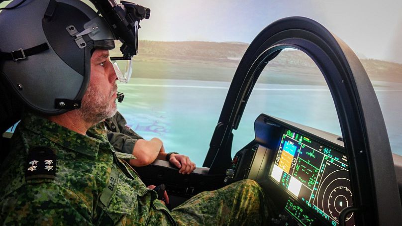 Admiral Rob Bauer, chairman of NATO's military committee, flies the F-35 simulator at Ørland Air Station.