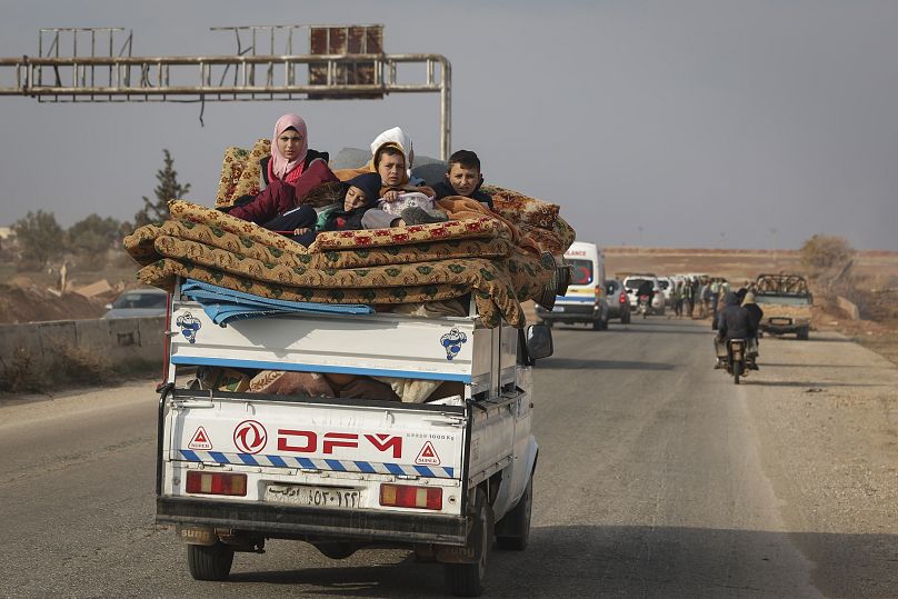 Residents leave Hama carrying their belongings in the aftermath of the opposition's takeover, 6 December, 2024