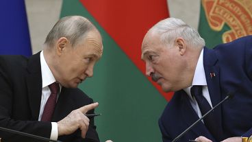 Russian President Vladimir Putin and Belarusian President Alexander Lukashenko talk during a signing ceremony in Minsk, 6 December, 2024