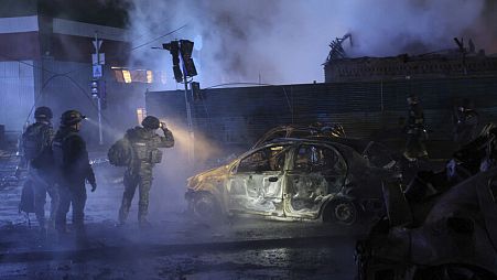 Police officers inspect cars destroyed by a Russian strike in Zaporizhzhia, Ukraine, Dec. 6, 2024