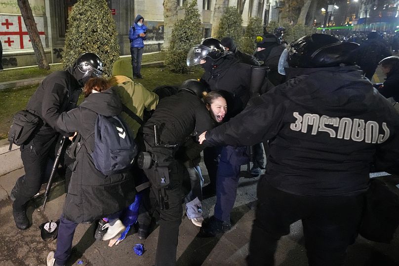 Police detain demonstrators during a protest against the government's decision to suspend negotiations on joining the European Union in Tbilisi, 7 December, 2024