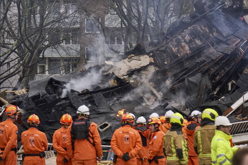 Firefighters at the scene of an explosion which destroyed several apartments in The Hague, 7 December, 2024