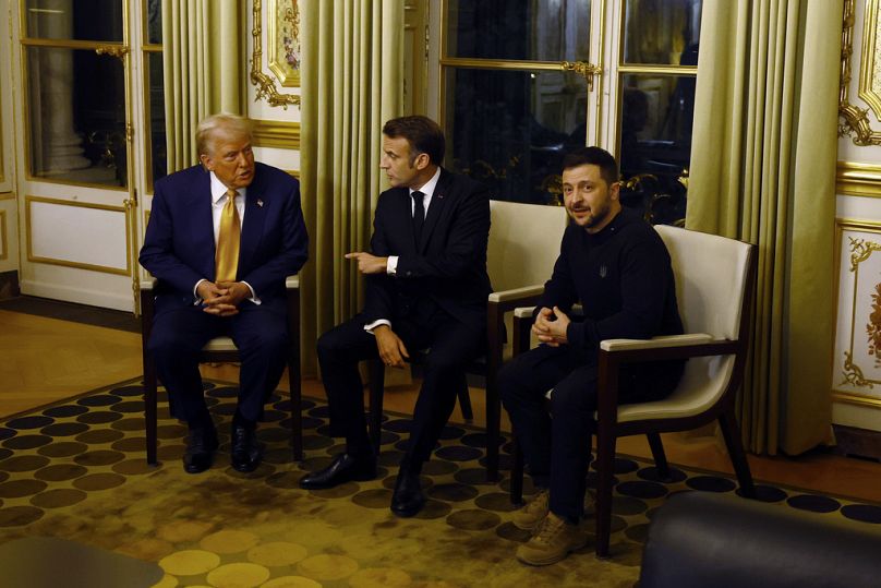 U.S. President-elect Donald Trump, French President Emmanuel Macron, center, and Ukraine's President Volodymyr Zelenskyy attend a meeting at the Elysee Palace in Paris