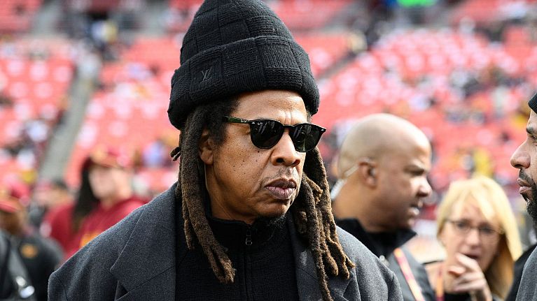 Jay-Z accused of raping 13-year-old alongside Sean ‘Diddy’ Combs - pictured: Jay-Z stands on the field before an NFL football game - 24 Nov 2024