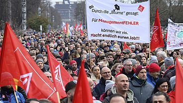 Volkswagen workers attend at a rally on the grounds of the main Volkswagen plant in Wolfsburg, Germany, Monday, Dec. 2, 2024.