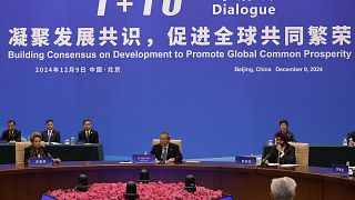 Chinese Premier Li Qiang attending a conference in Beijing on promoting world economic growth