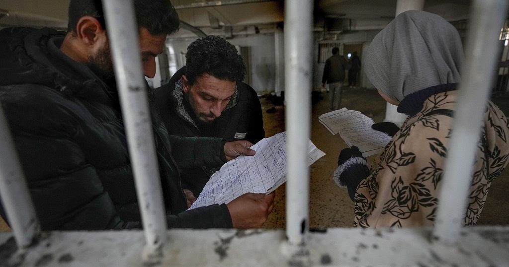 Syrians rush to notorious prison to search for loved ones